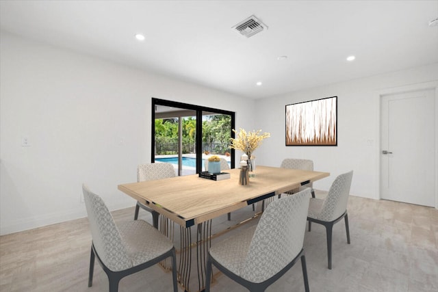 dining space with light wood-type flooring