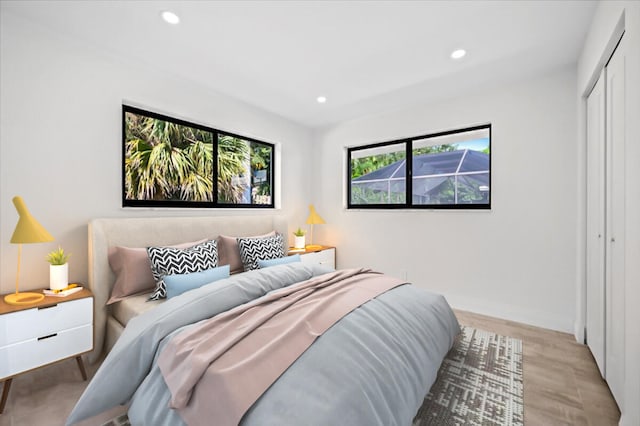 bedroom featuring a closet and light hardwood / wood-style floors