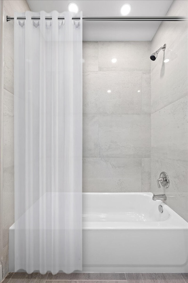 bathroom featuring shower / tub combo with curtain