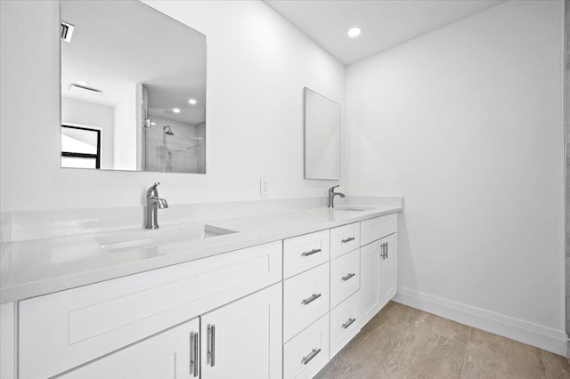 bathroom with vanity and a shower with shower door