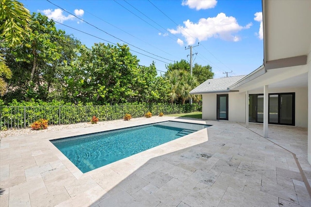 view of swimming pool featuring a patio area