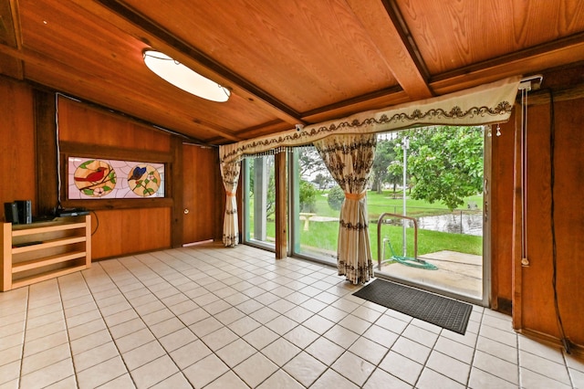 unfurnished sunroom featuring lofted ceiling with beams and wood ceiling