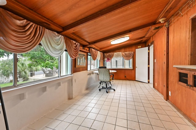 interior space with wood ceiling and lofted ceiling with beams