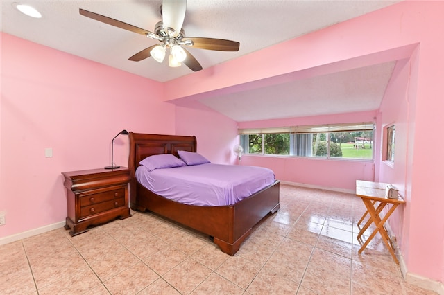 bedroom featuring light tile patterned flooring and ceiling fan