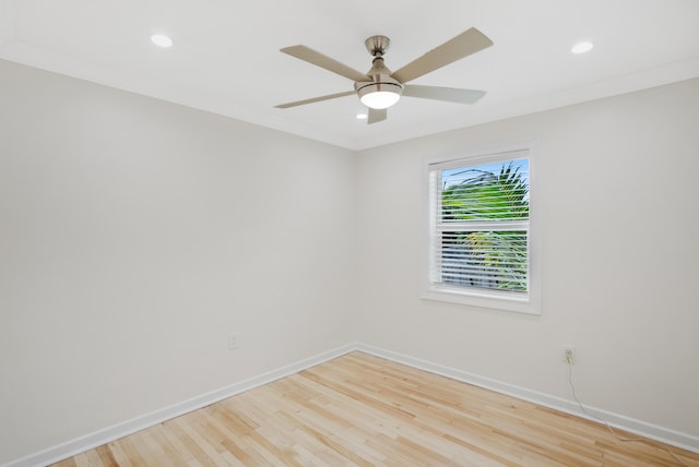 unfurnished room featuring light hardwood / wood-style flooring, ornamental molding, and ceiling fan