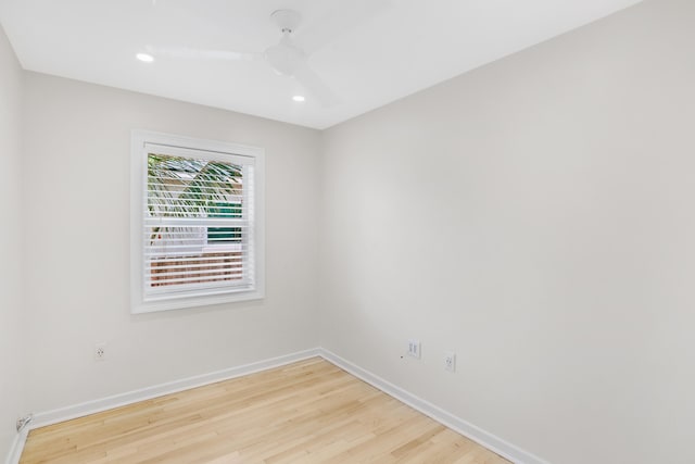 spare room featuring ceiling fan and light wood-type flooring