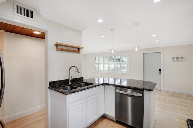 kitchen with white cabinetry, dishwasher, light hardwood / wood-style floors, and sink