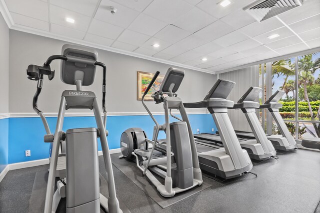 workout area featuring a paneled ceiling