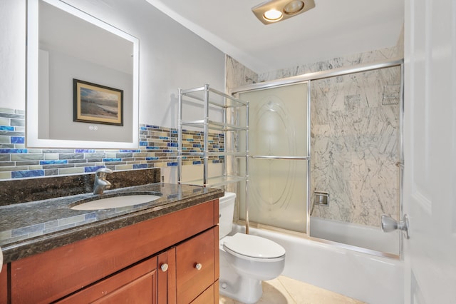 full bathroom featuring vanity, bath / shower combo with glass door, toilet, and backsplash