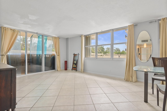 living room with light tile patterned floors