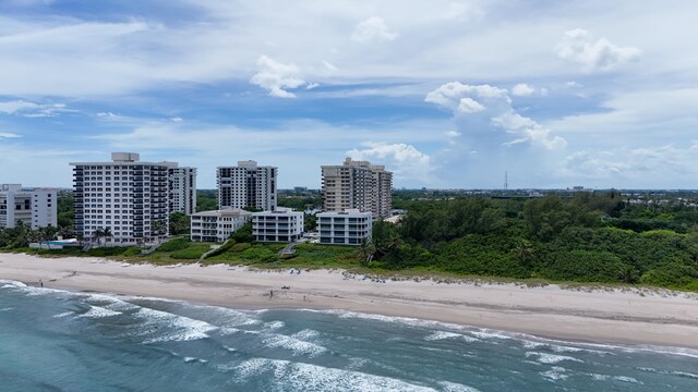 bird's eye view featuring a water view and a view of the beach