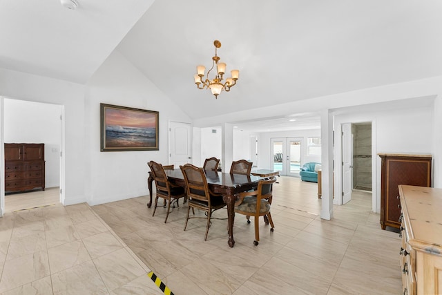 tiled dining room with a notable chandelier, french doors, and vaulted ceiling