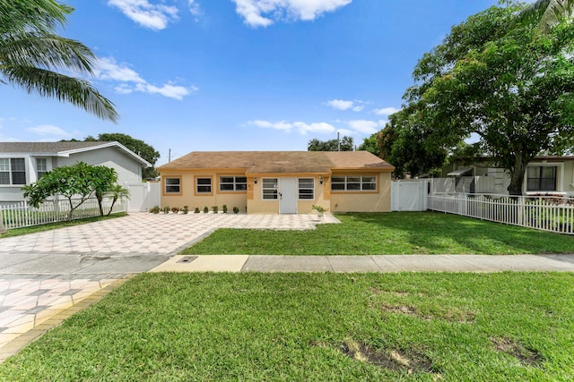 ranch-style house with a front yard