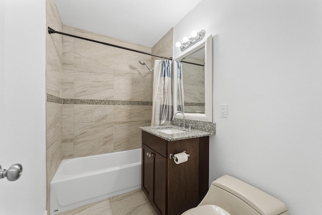 full bathroom featuring shower / bath combo with shower curtain, toilet, tile patterned floors, and vanity