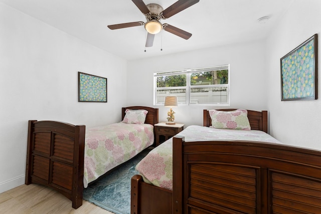 bedroom featuring ceiling fan and light hardwood / wood-style floors