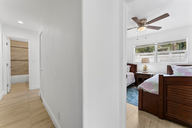 tiled bedroom featuring ceiling fan