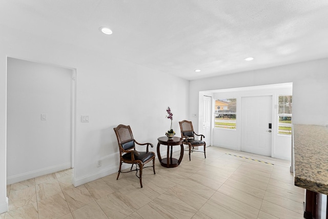 living area featuring light tile patterned flooring