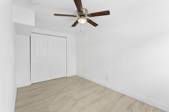 unfurnished bedroom featuring light tile patterned flooring, a closet, and ceiling fan