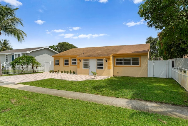 ranch-style house with a front yard