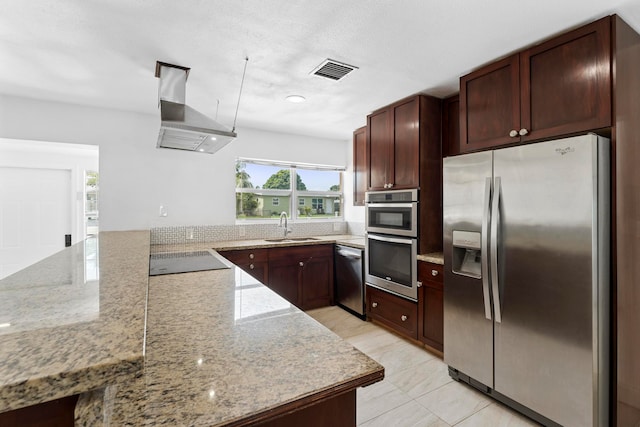 kitchen with range hood, light tile patterned flooring, stainless steel appliances, light stone counters, and sink