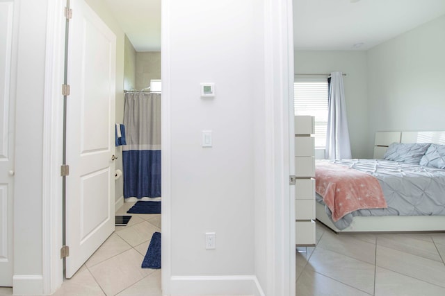 bedroom featuring light tile patterned flooring