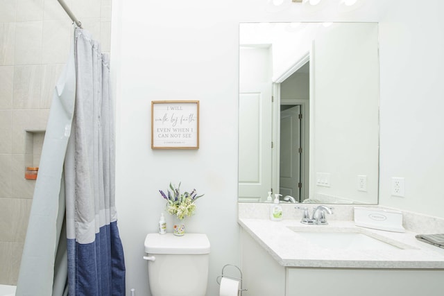 bathroom with vanity, a shower with curtain, and toilet