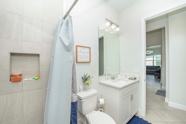 bathroom featuring vanity, tile walls, toilet, and tile patterned flooring