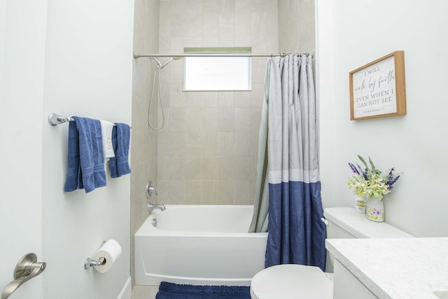 full bathroom featuring shower / bath combination with curtain, vanity, and toilet