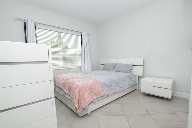 bedroom featuring light tile patterned floors