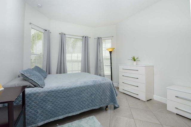 bedroom featuring light tile patterned floors