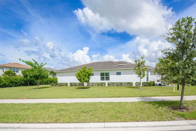 single story home featuring a front yard