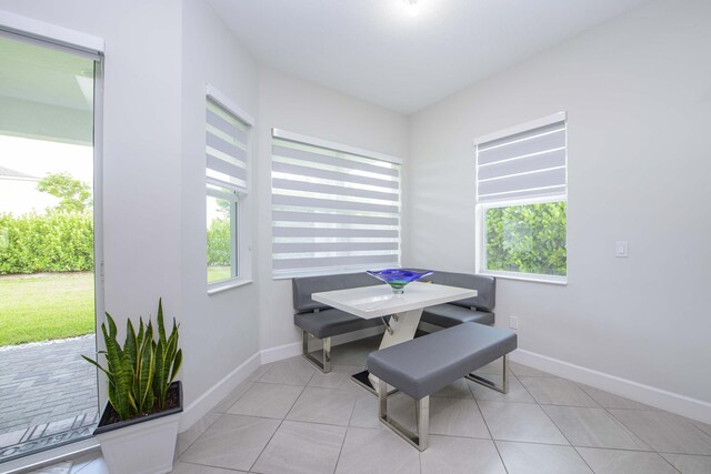 dining space with light tile patterned floors