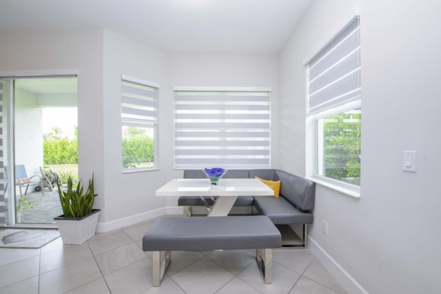 tiled dining area with breakfast area and plenty of natural light