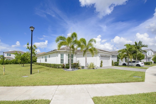 ranch-style home featuring a garage and a front yard