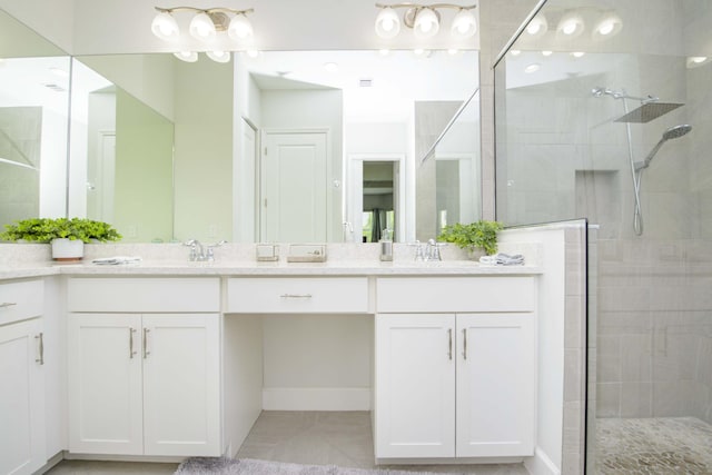 bathroom with vanity and an enclosed shower