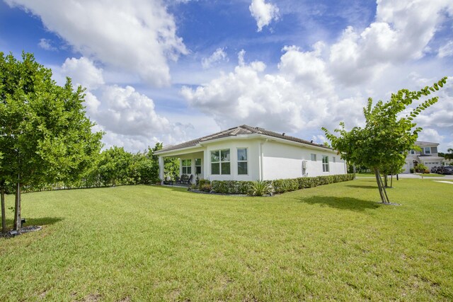 view of home's exterior featuring a lawn