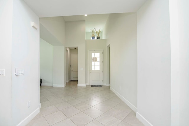 foyer entrance with light tile patterned floors