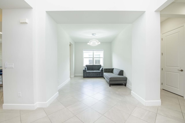 hallway featuring light tile patterned floors