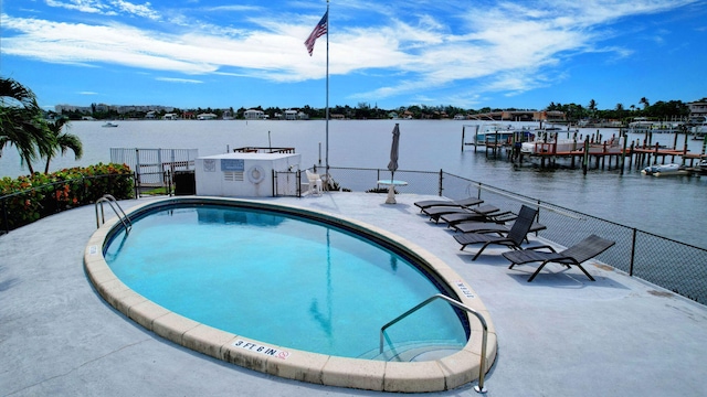 view of pool featuring a water view