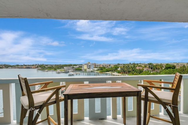 balcony featuring a water view