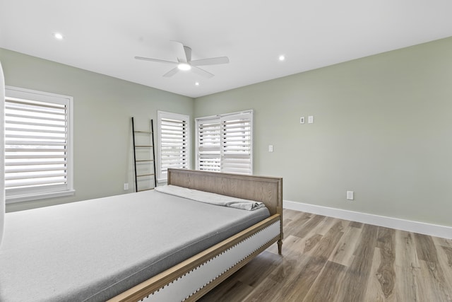 bedroom featuring light wood-style floors, recessed lighting, ceiling fan, and baseboards