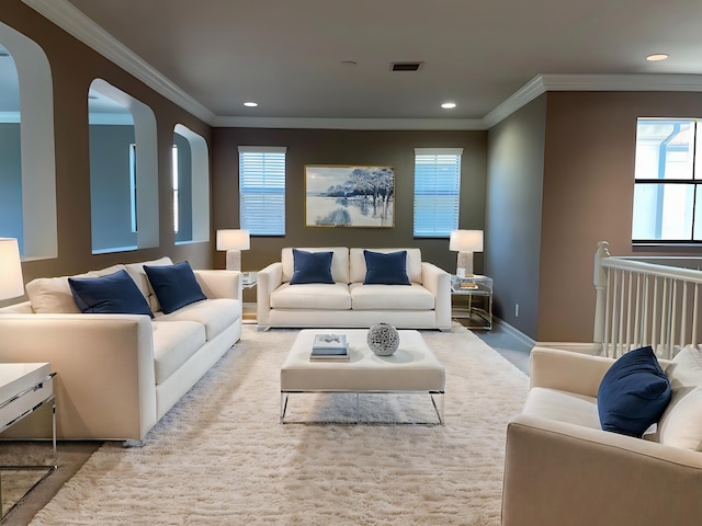 living room featuring light carpet and crown molding