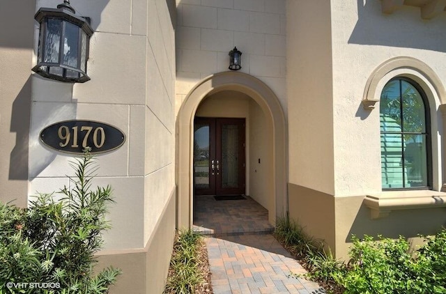 property entrance featuring french doors