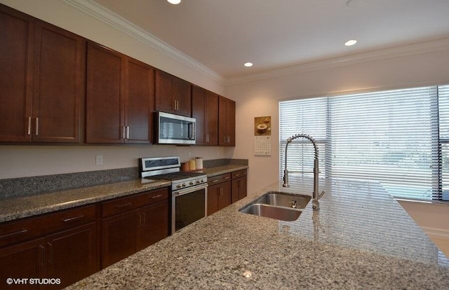 kitchen featuring sink, stainless steel appliances, ornamental molding, and light stone countertops