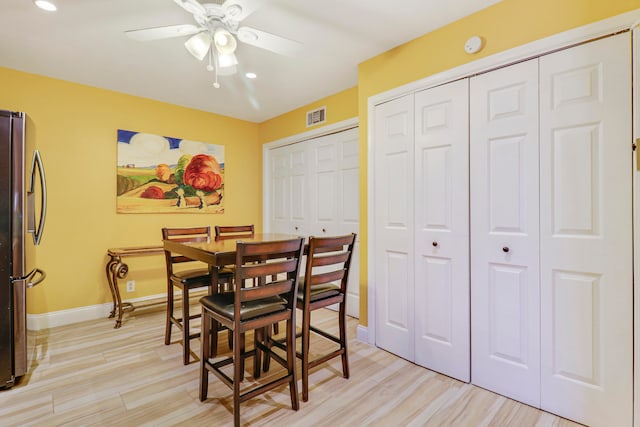 dining space featuring ceiling fan and light hardwood / wood-style floors