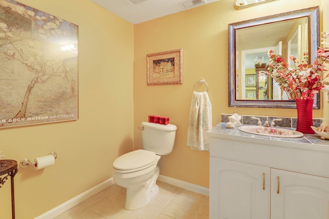 bathroom featuring tile patterned floors, vanity, and toilet