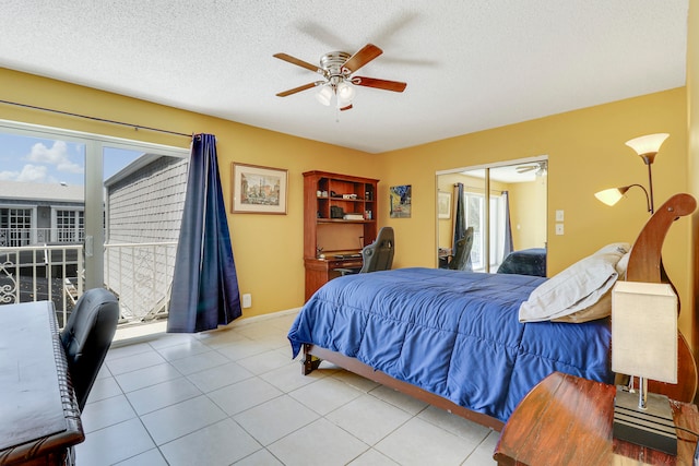 bedroom with ceiling fan, a closet, a textured ceiling, and light tile patterned floors