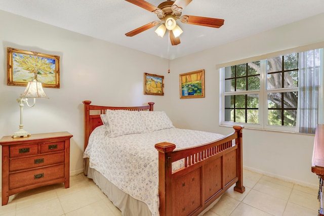 tiled bedroom with ceiling fan