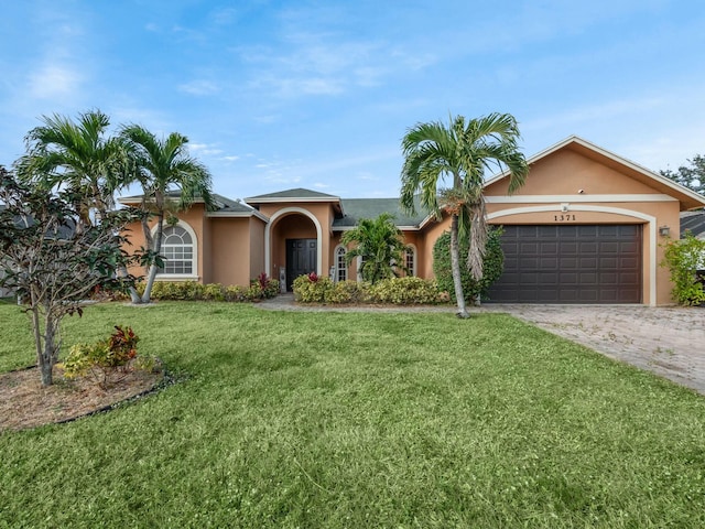 ranch-style home featuring a front yard and a garage