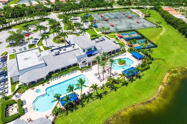 birds eye view of property with a water view